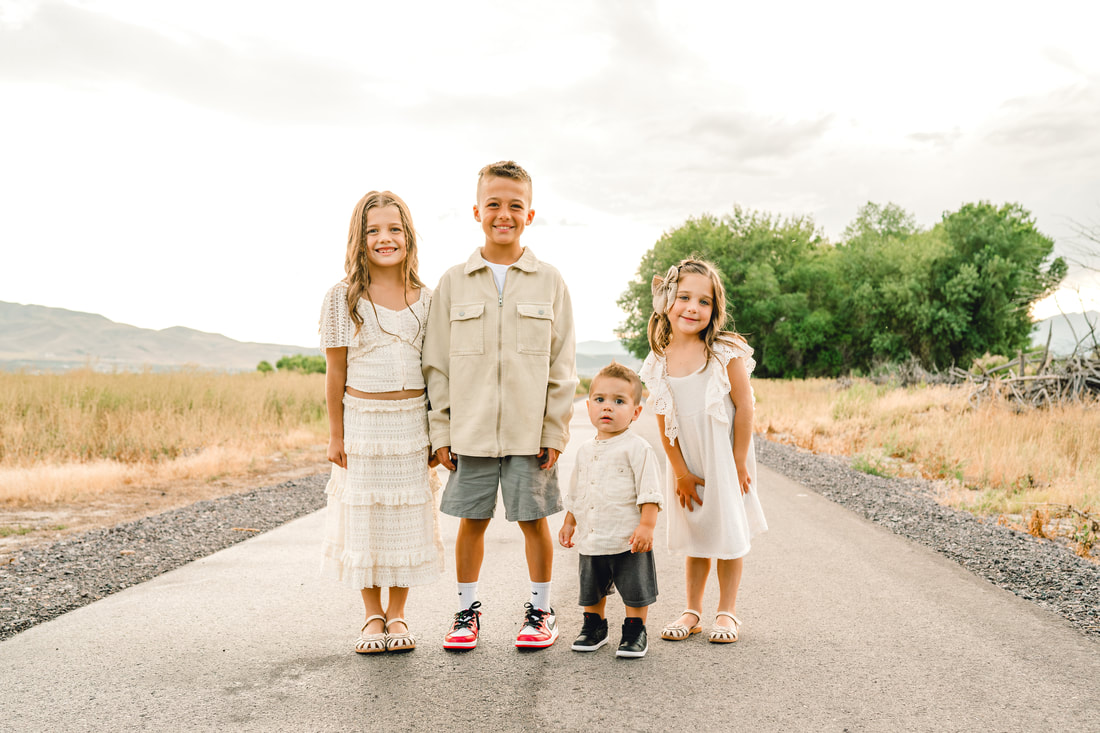 Four children on a trail near Utah Lake