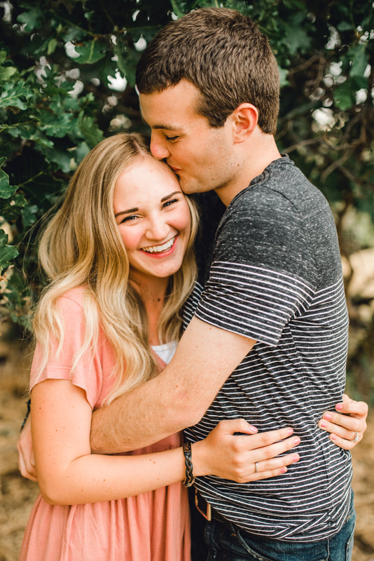 Couple laughing together engagement photos