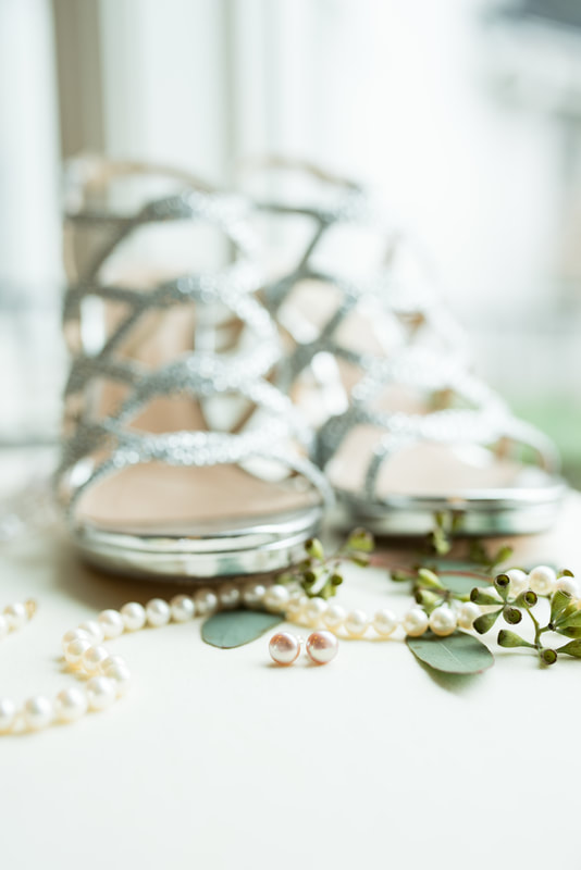 Wedding details - pearls, flowers, earrings, shoes