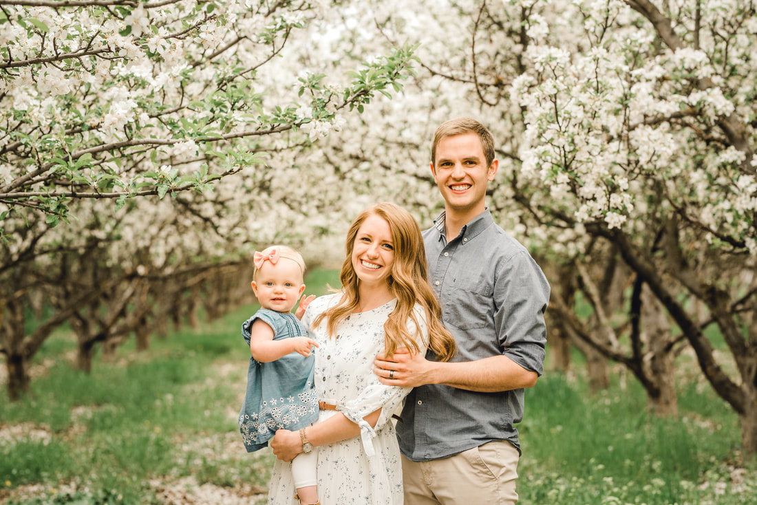 Family photos in an apple orchard