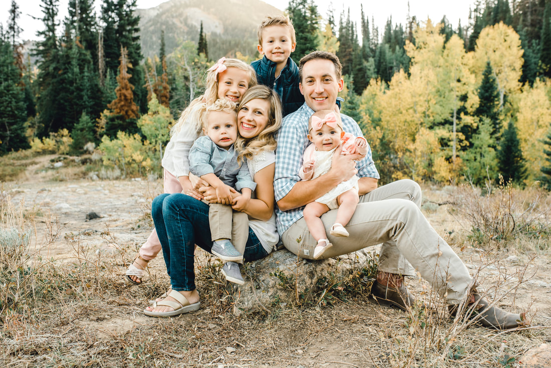 Family photo at Jordan Pines with Utah mountains behind