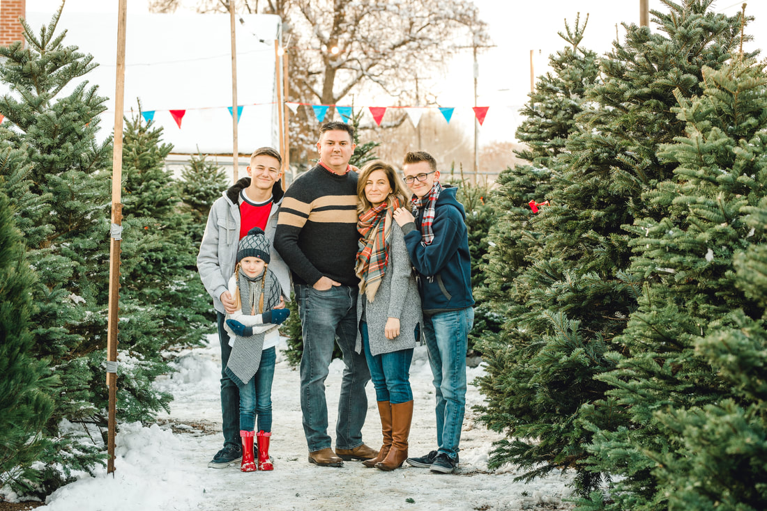 Family portrait by Flying Gull Photography at a Christmas Tree Farm in Lehi Utah