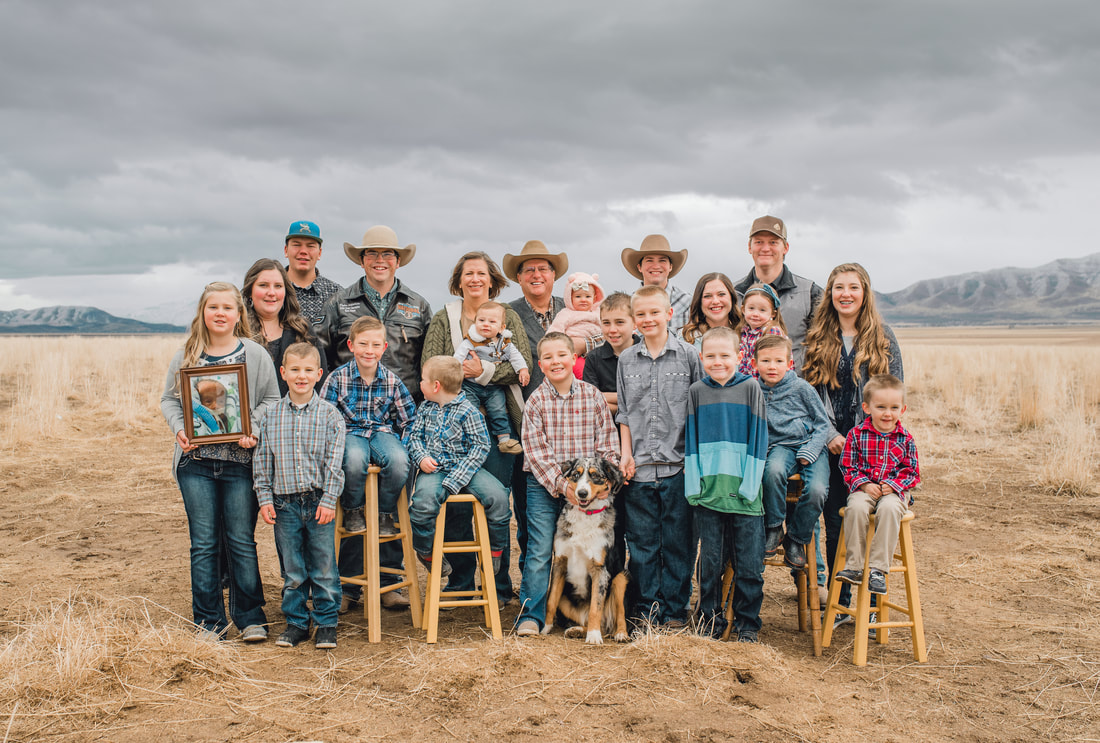 Grandchildren and grandparents in a field in Eagle Mountain, Utah