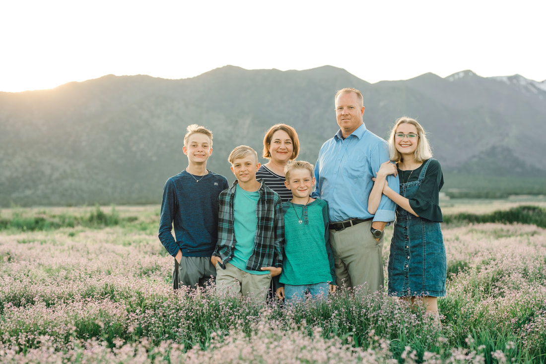 Family portrait in a field of wildflowers in Eagle Mountain Utah
