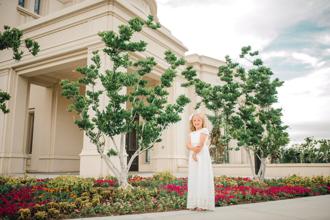 Girl in baptism dress in front of Payson LDS temple