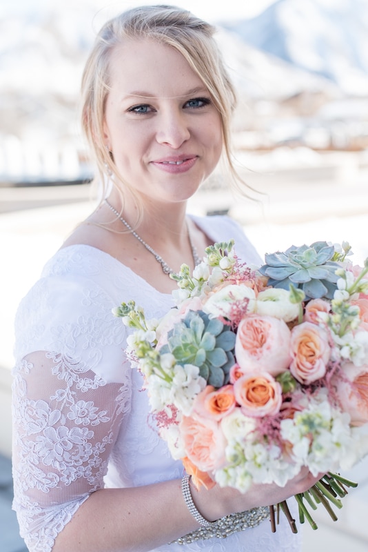 Close-up portrait of bride with bouquet