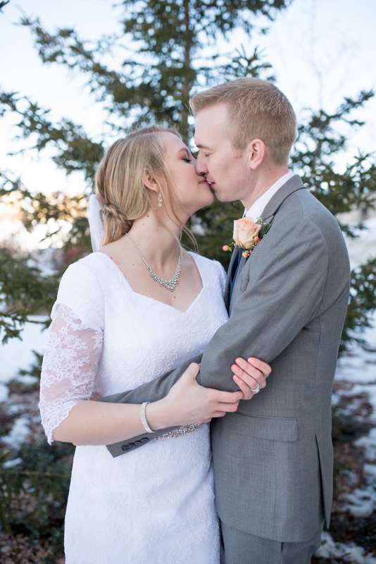 Photo of wedding couple almost kissing