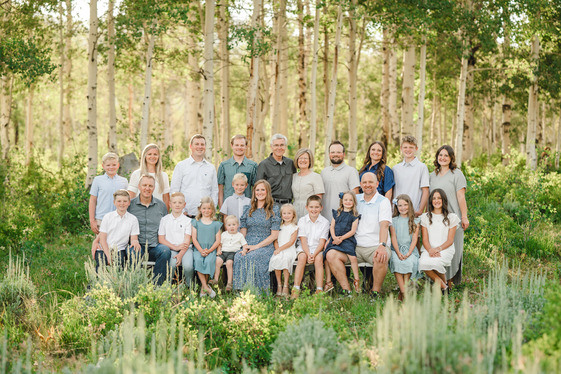 Amazing extended family portrait in the Utah mountains with aspen trees and wildflowers
