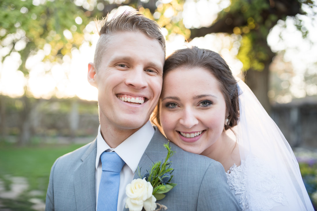 Smiling portrait of bride and groom