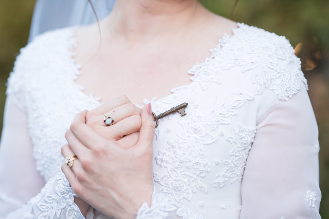 Bride holding key to her heart