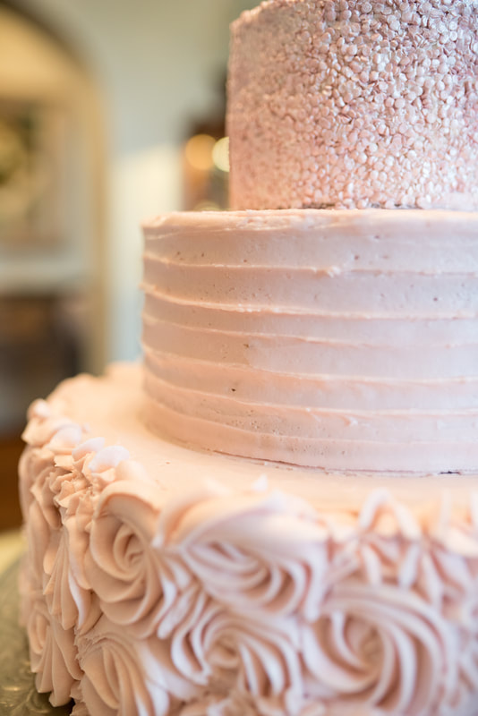 Pink frosted wedding cake